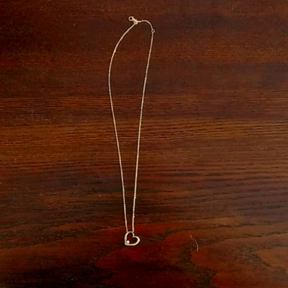 Gold heart necklace with diamond in the bottom